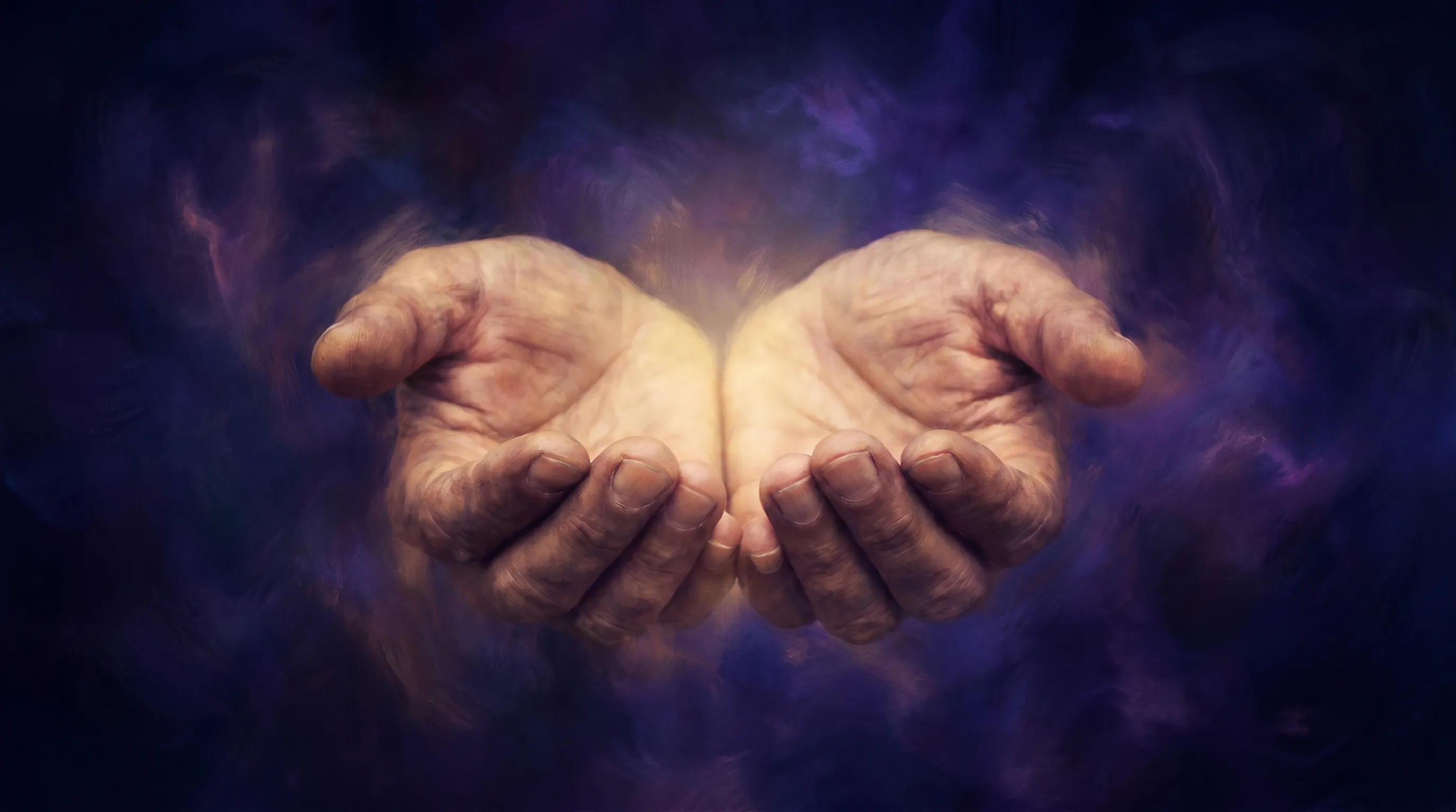 Hands cupped with a soft golden glow between them on a deep indigo background — what is spiritual healing